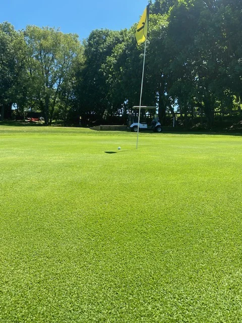 Greenskeeper Jimmy at work on a green at Silver Spring Golf Club in Riverside RI